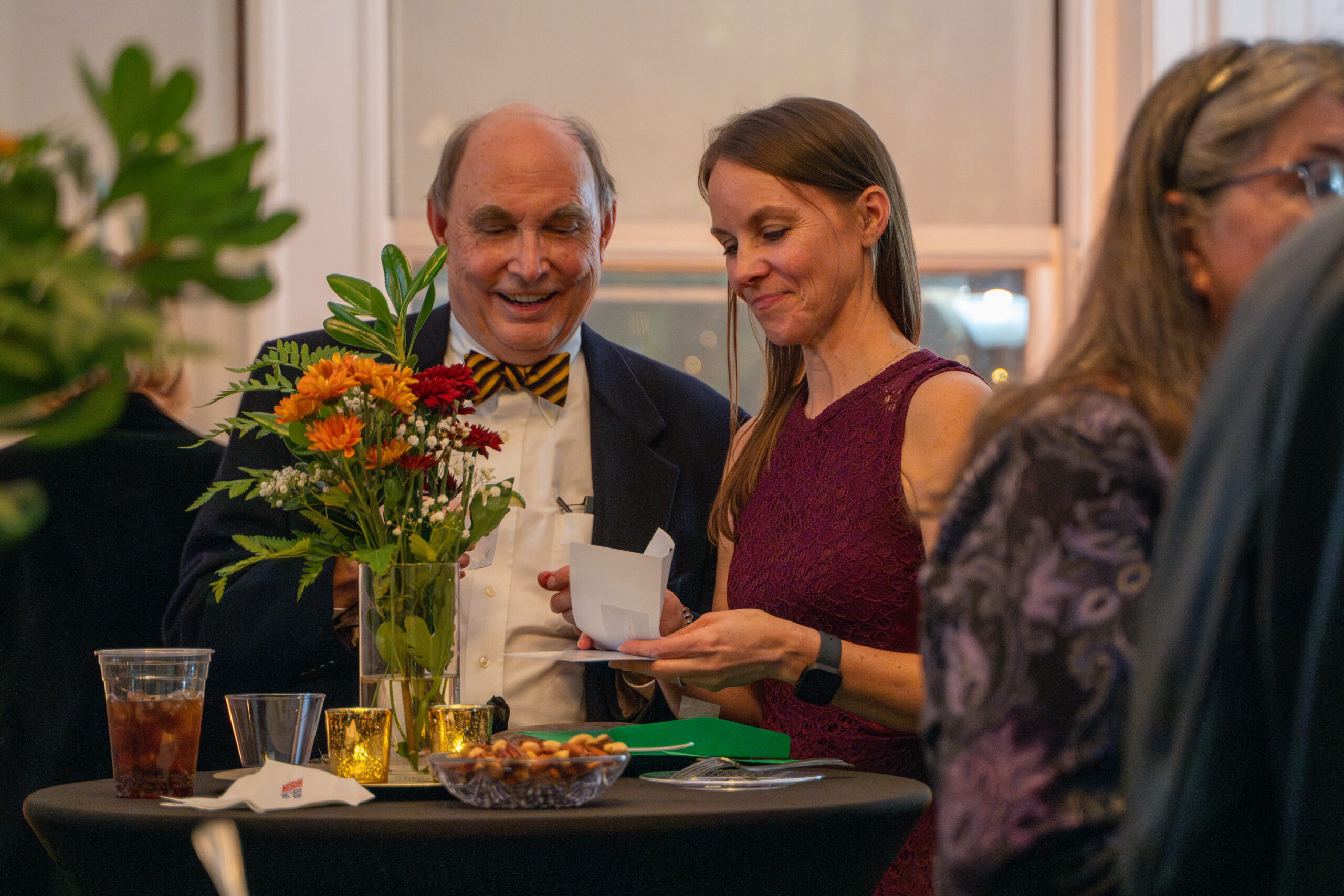 Smiling guest reacting during fundraiser speech