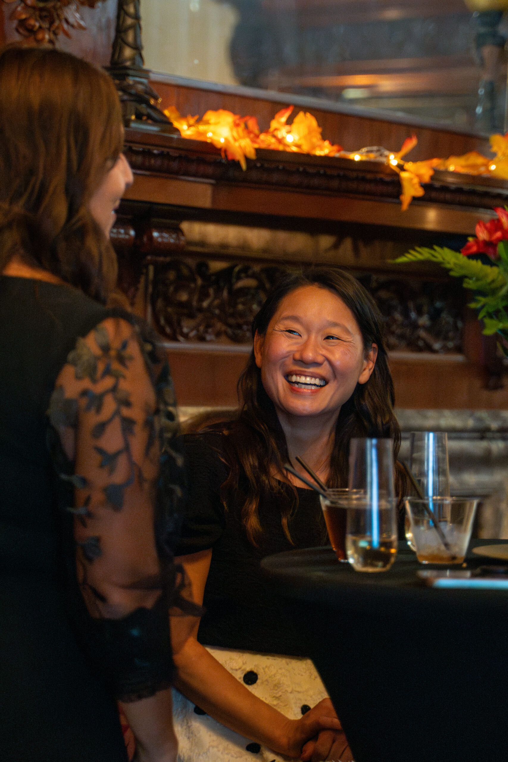 Candid laughter during fundraiser at Rivermont Mansion