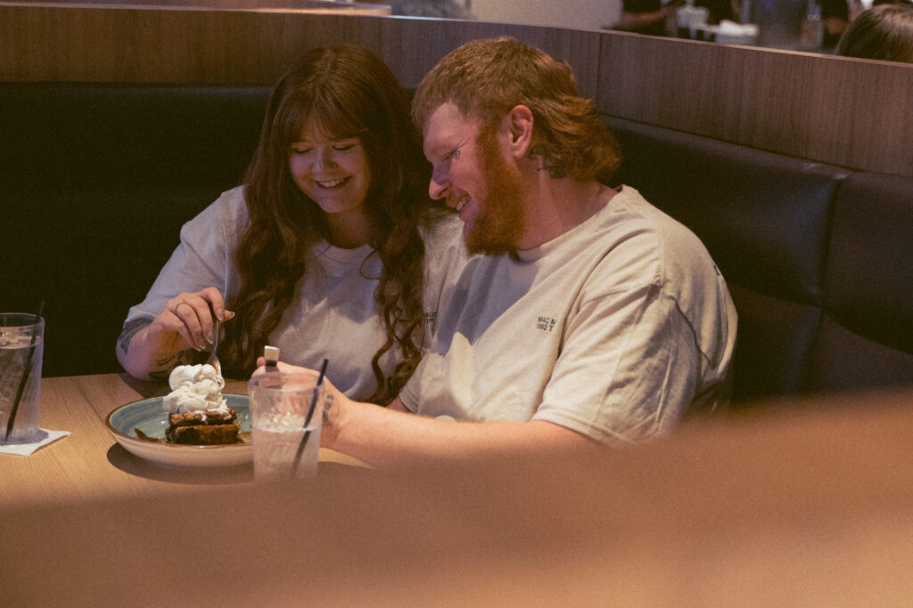Brookie sundae tower with a cherry during a playful diner engagement session