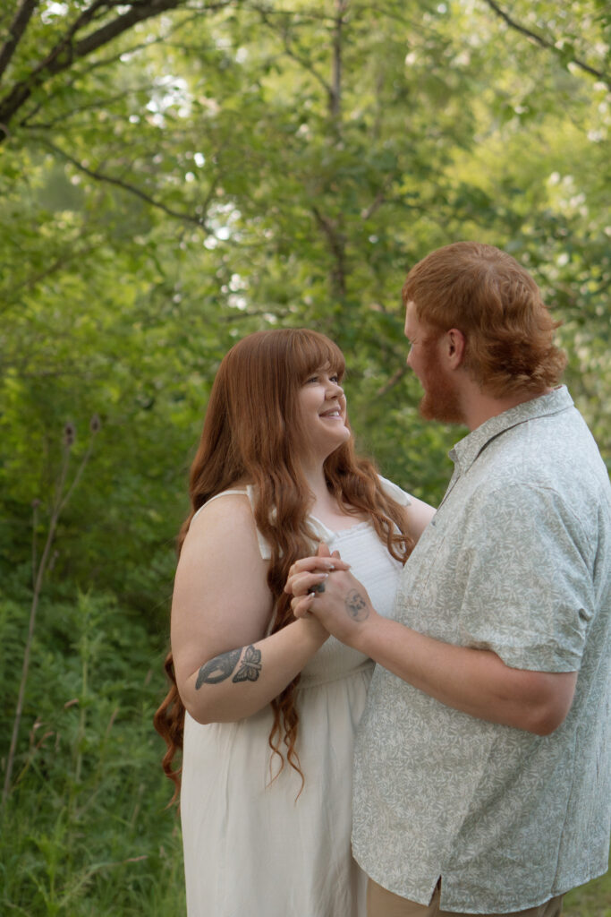Timeless outdoor engagement portrait in a flower field in Davenport Iowa