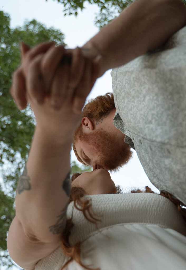 Close-up of a couple Kissing during their outdoor engagement session